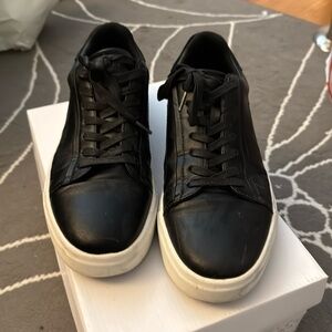 Calvin Klein. Black shoe with whites trim. Laces. Size 10.